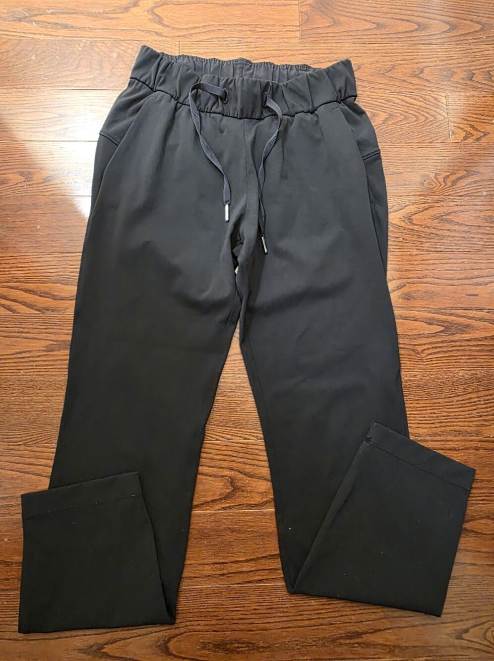 Black Lululemon athletic drawstring pants.